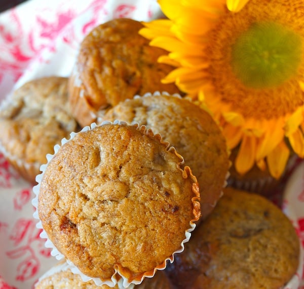 Honey spiced banana muffins with a big, pretty sunflower.