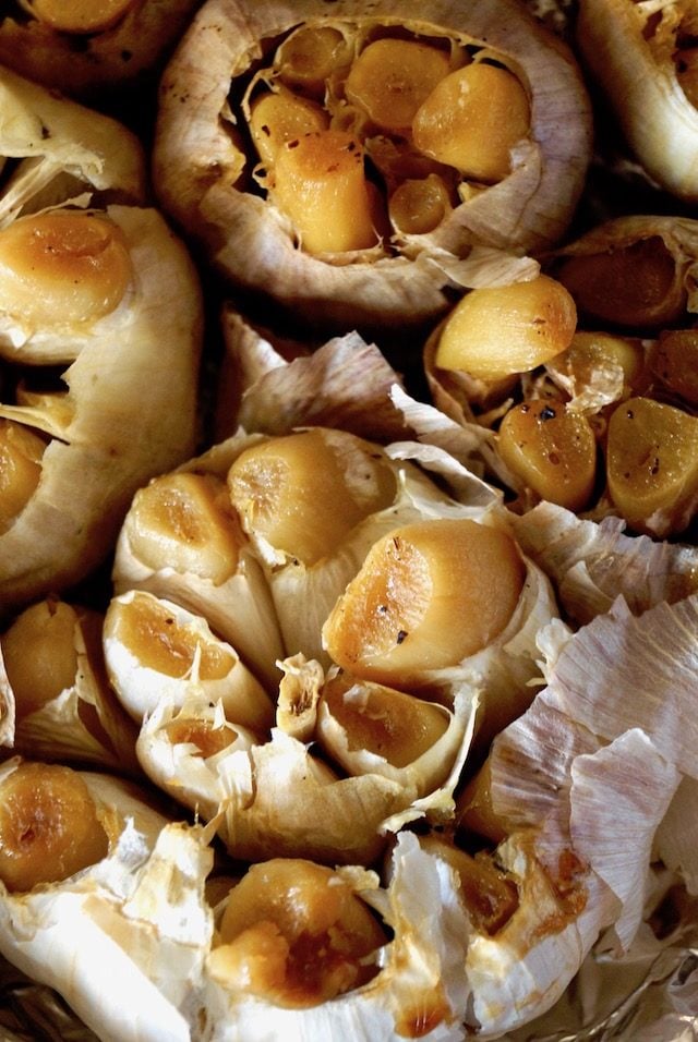 close up of roasted heads of garlic