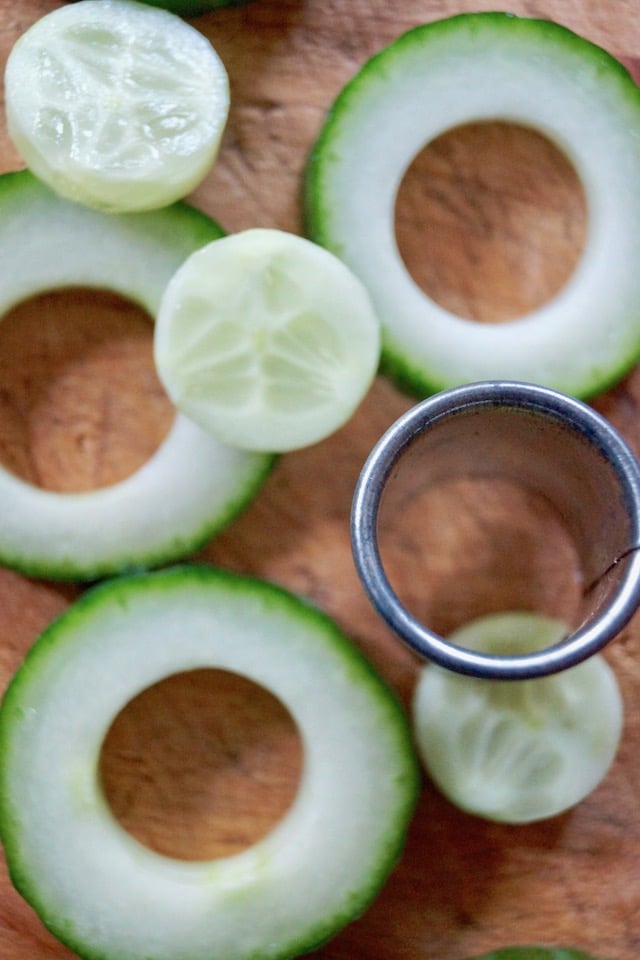 A few slices of cucumber with the centers cut out with a round cutter.