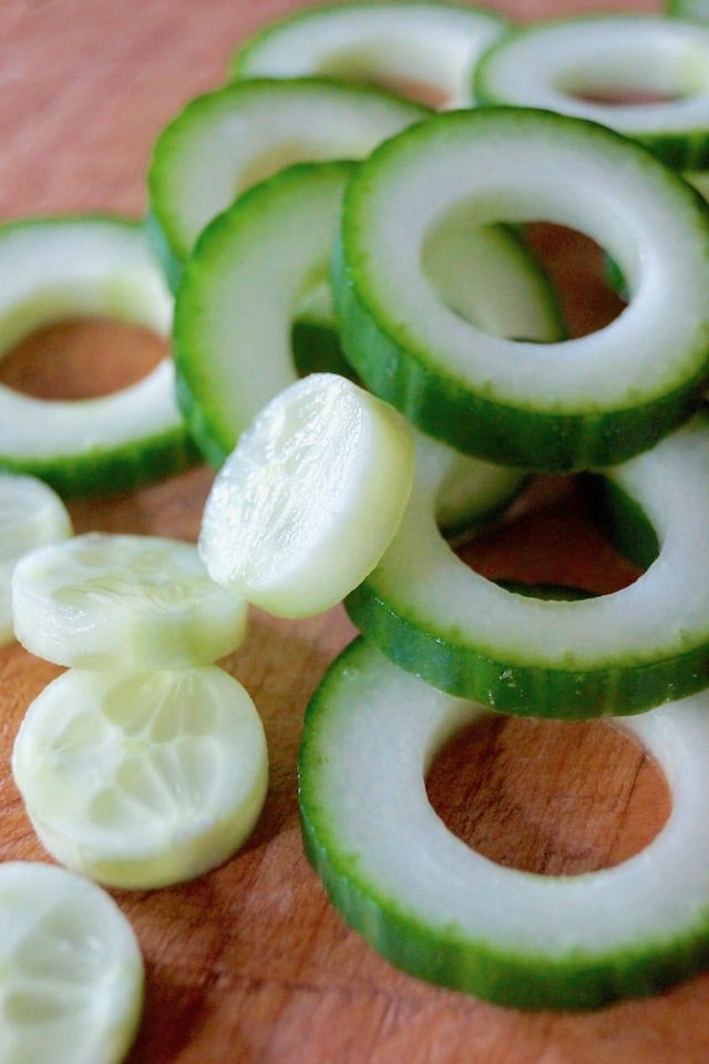 Several cucumber slices with the centers cut out.