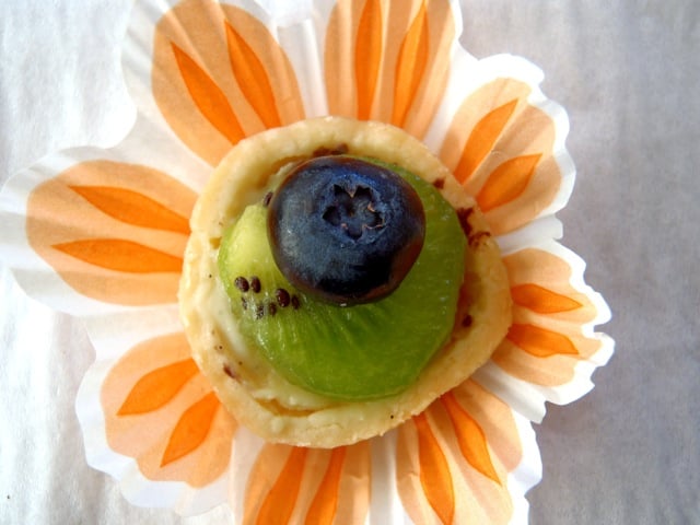 one Dessert Party Fresh Fruit Tartlet with kiwi and a blueberry