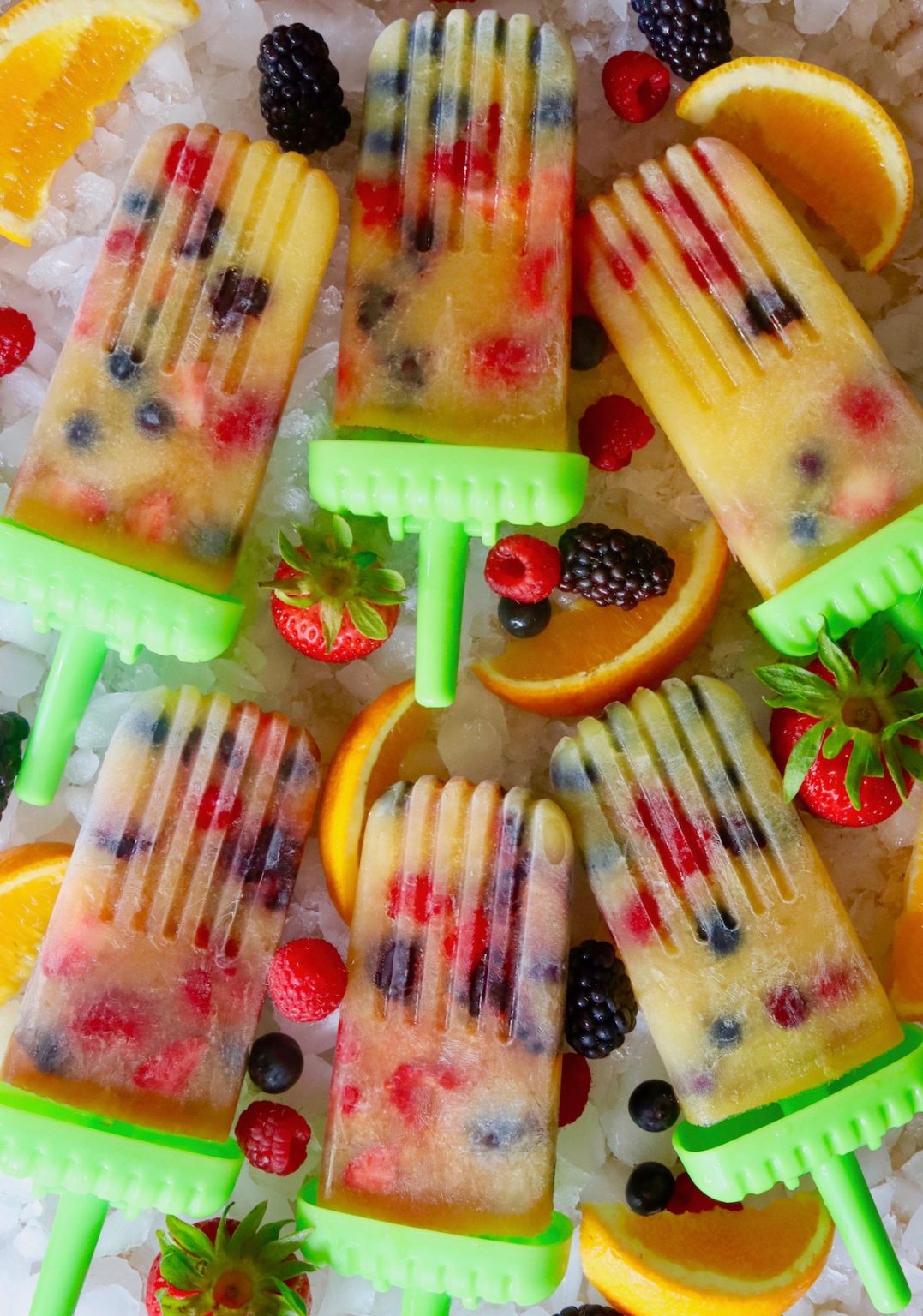 Orange Popsicles with Berries Cooking On The Weekends