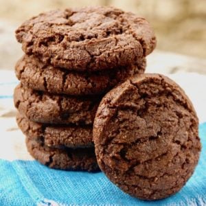 Stack of Double Chocolate Almond Spice Cookies with one resting on it