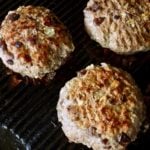 Three Grilled Mediterranean Burgers on the grill.