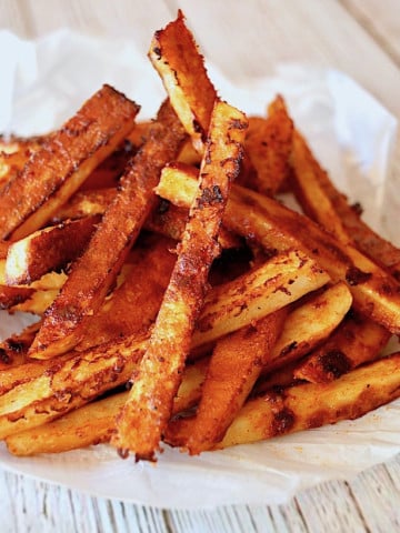 pile of Smoky Chipotle French Fries on Parchment