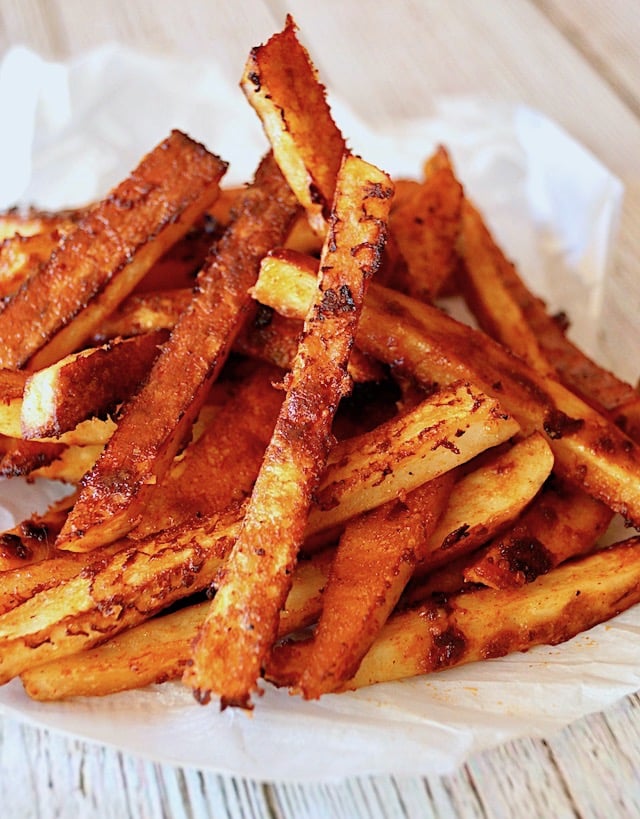 pile of Smoky Chipotle French Fries on Parchment