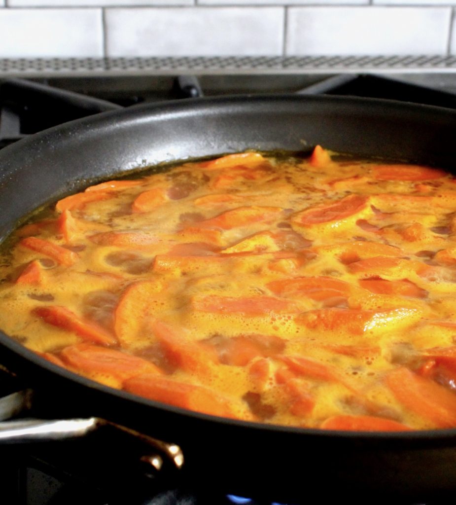 sliced carrots in stock in saute pan
