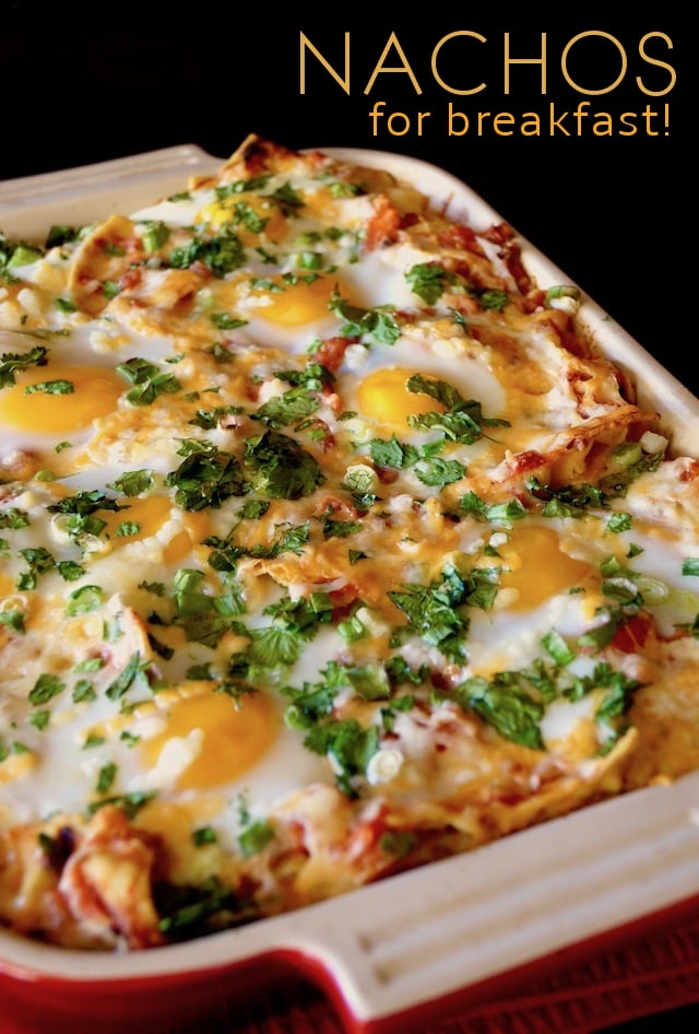 Casserole dish of Chipotle Breakfast Nachos with Eggs with cilantro sprinkled on top.