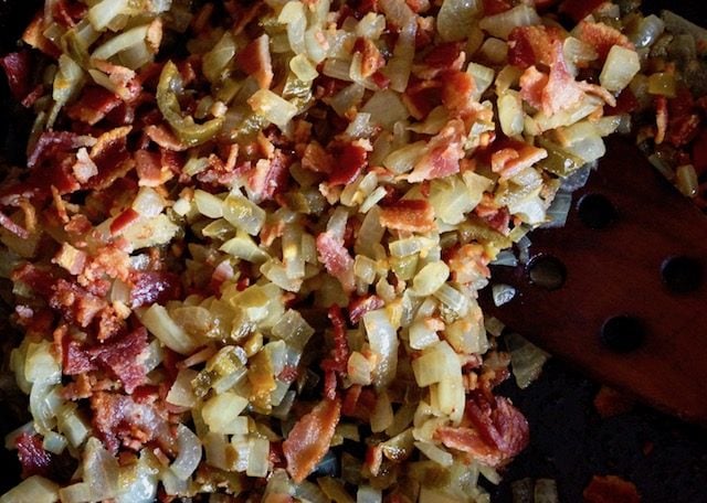 onion, jalapeno and bacorn mix in cast iron skillet