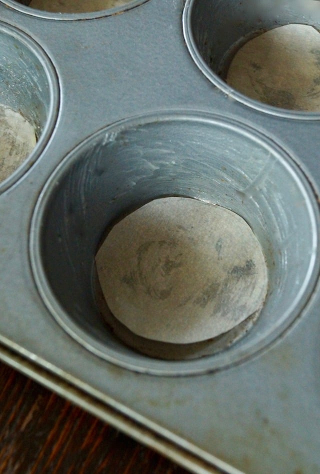 Muffin tin with parchment circles in each cup