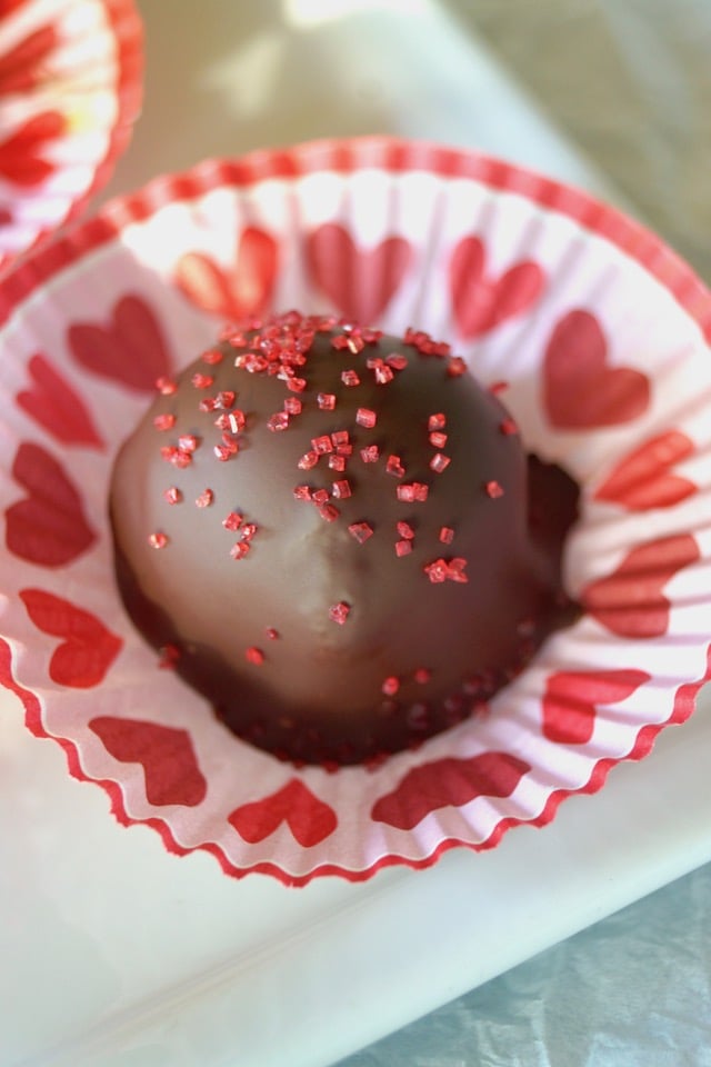 Spicy Mayan Chocolate Truffle in a pink and red paper truffle cup for Valentine's Day.