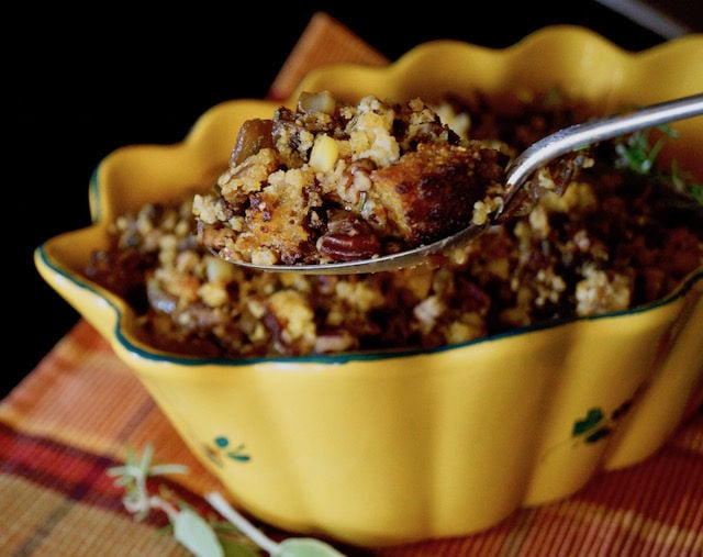 Large spoonful of Gluten-Free Cornbread Stuffing over serving dish