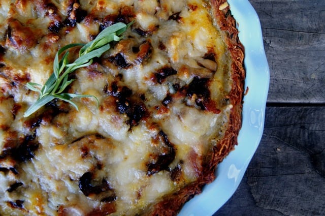 Mushroom Bacon Savory Pie with Potato Crust in a light blue pie plate.