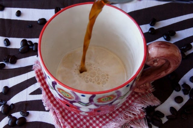 This is how to make coffee with half and half -- coffee being poured into the half and half 