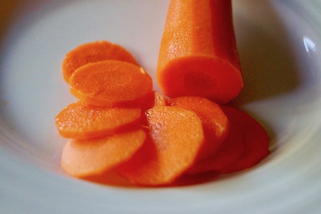 One peeled carrot with super thin round slices.
