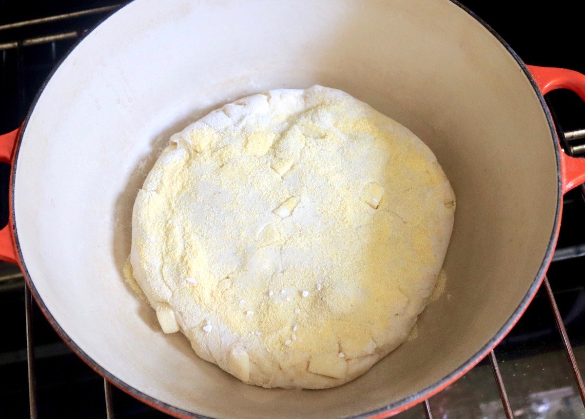 Raw bead dough in a large dutch oven.