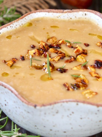 Potato Chestnut Soup in cream bowl with crimped rim