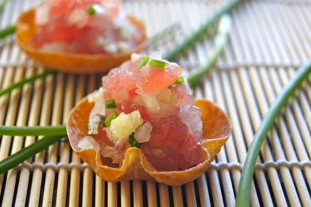 Ginger Ahi Tuna Tartare recipe in wonton cups on bamboo sushi mat