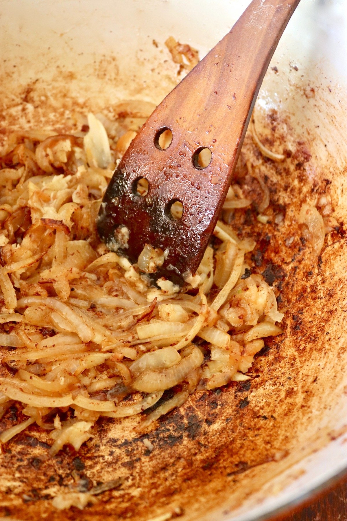 caramelized onion in the bottom of a Dutch oven