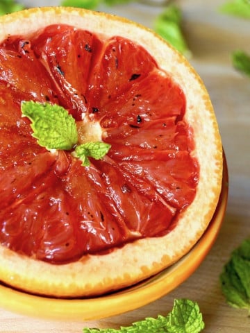 Grapefruit Brulee with fresh mint in a n orange bowl