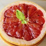 Onse serving of Grapefruit Brulee with fresh mint