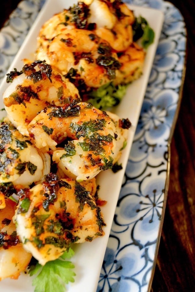 Spicy Cilantro Shrimp on a narrow blue floral plate