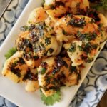 Close up of Spicy Cilantro Shrimp on a white plate