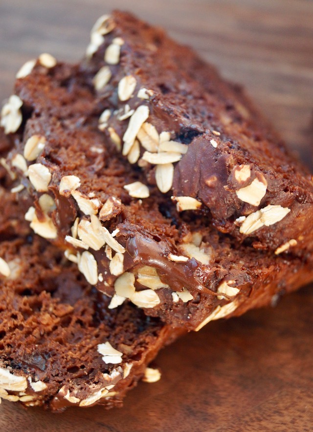 three slices of chocolate breakfast bread on wooden board