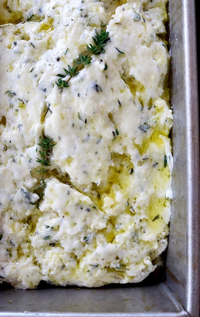 top view of Italian herb bread batter in loaf pan