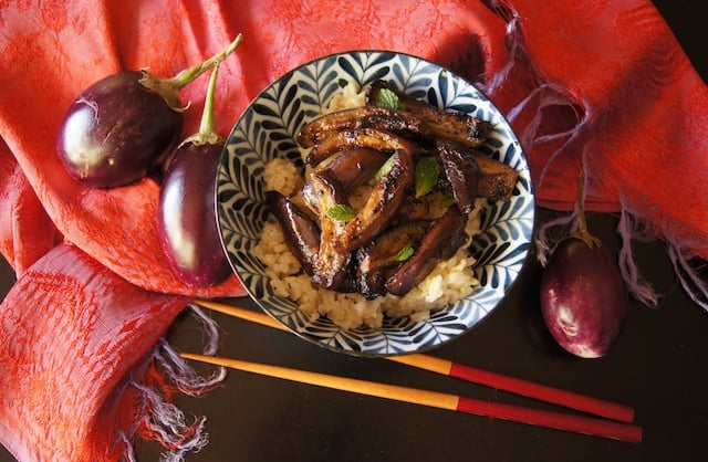 Spicy Miso Eggplant in a bue and white bowl with chopsticks