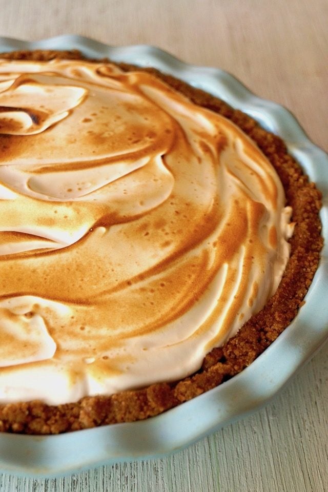 Close up of Peanut Butter Chocolate Meringue Pie in light blue pie dish