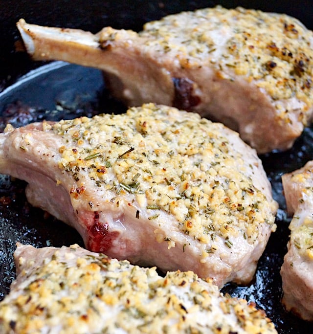 garlic rosemary pork chops in cast iron skillet