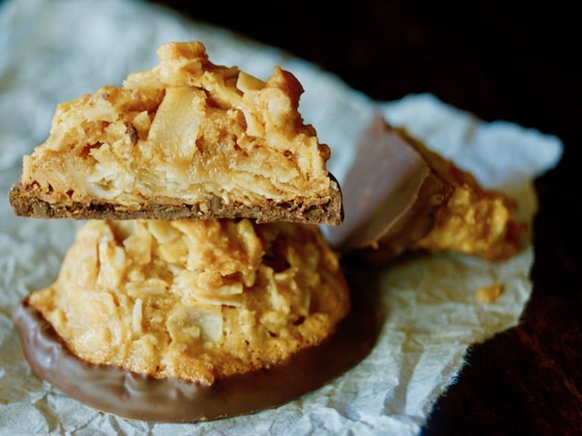 Stack of 2 Salted Dulce de Leche Coconut Macaroons, with one cut in half.