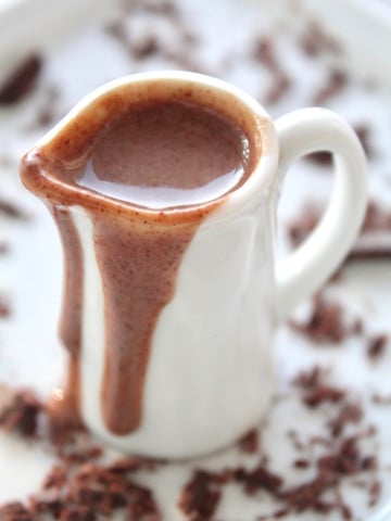 Chocolate Creme Anglaise with Frangelico dripping on the side of a white pitcher