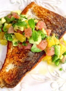 Sauteed Whitefish, skin side up with salsa on white plate