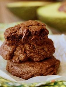 Small stack of chocolate avocado cookies with melting chocolate chips
