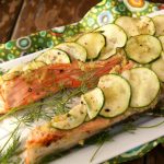 King salmon steak with sliced zucchini on top