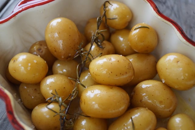 Close up of Baby Rosemary Confit Potatoes in baking dish