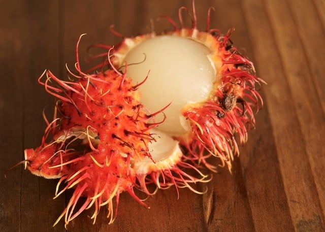 One partially peeled Rambutan.