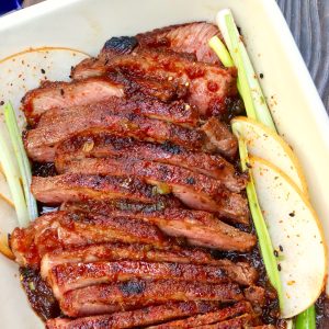 Thinly sliced Asian pear marinated steak with pear slices