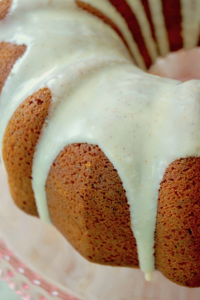 Close up of glaze on Eggnog Bundt Cake with Poppy Seeds