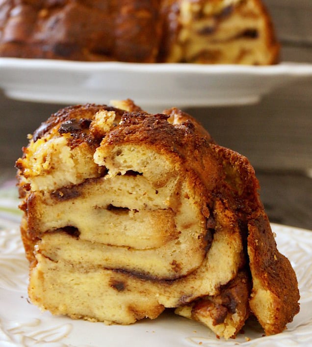 one large slice of French Toast Bread Pudding on white plate