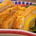 a few slices of quinoa fried chicken with lemon wedge
