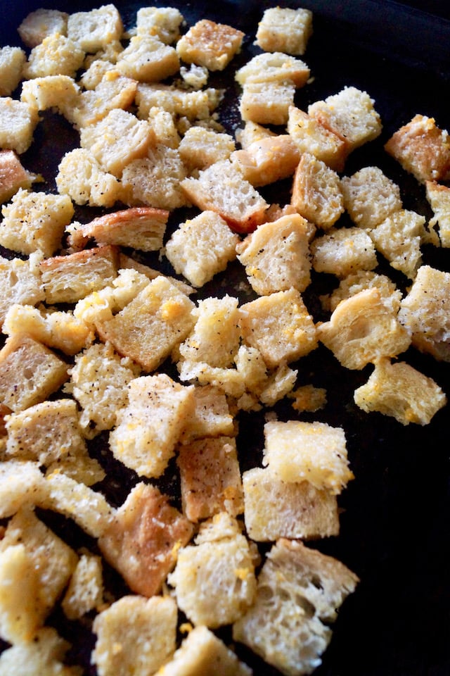 Lemon Garlic Roasted Croutons on a baking sheet before going in the oven.