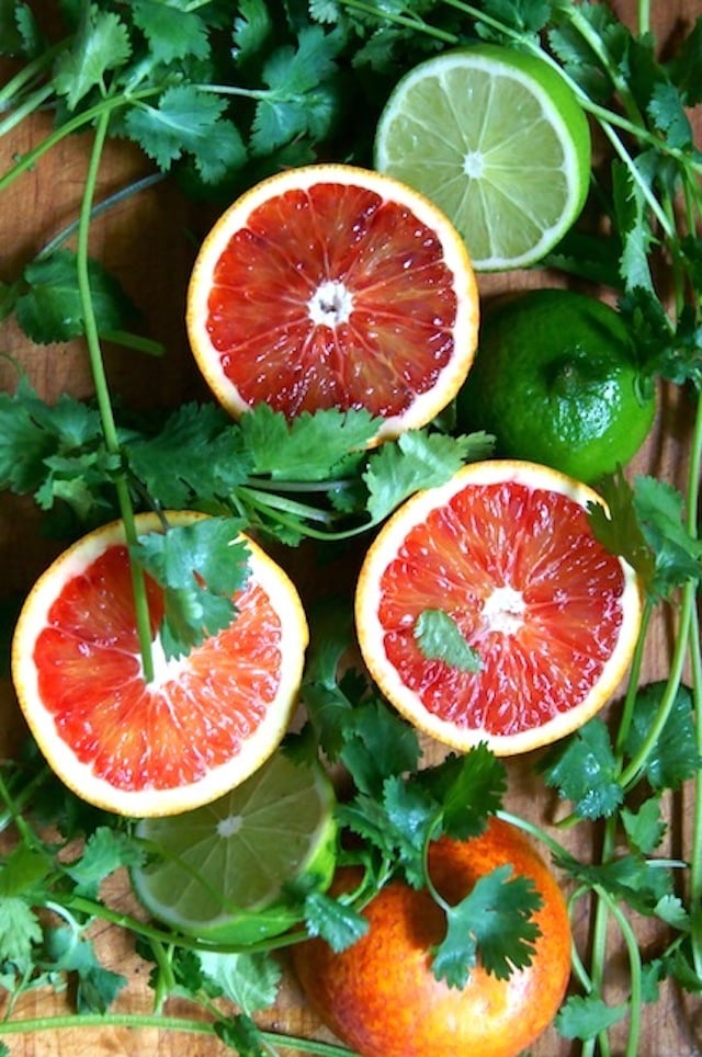 blood oranges and limes cut in half with fresh cilantro