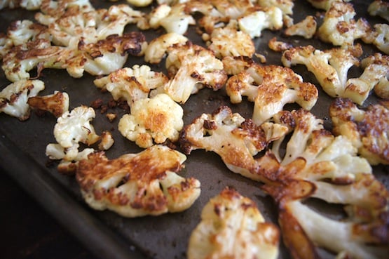 sheet pan of roasted cauliflower pieces for Roasted Cauliflower Basil Soup Recipe