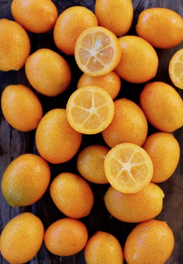 kumquats on wood surface