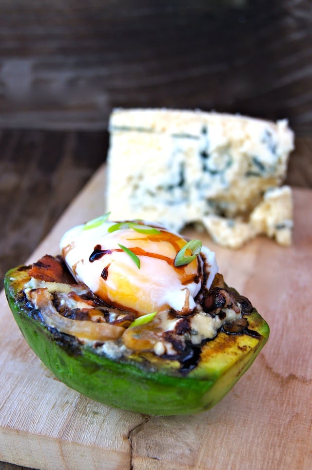 Grilled Avocado and Egg with Bacon Compote with a huge chunk of Cashel blue cheese one wood block