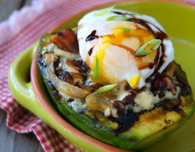 Grilled Avocado and Egg with Bacon Compote in a green bowl