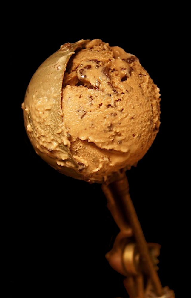 One scoop of Kahlua Espresso Gelato in a copper ice cream scoop.